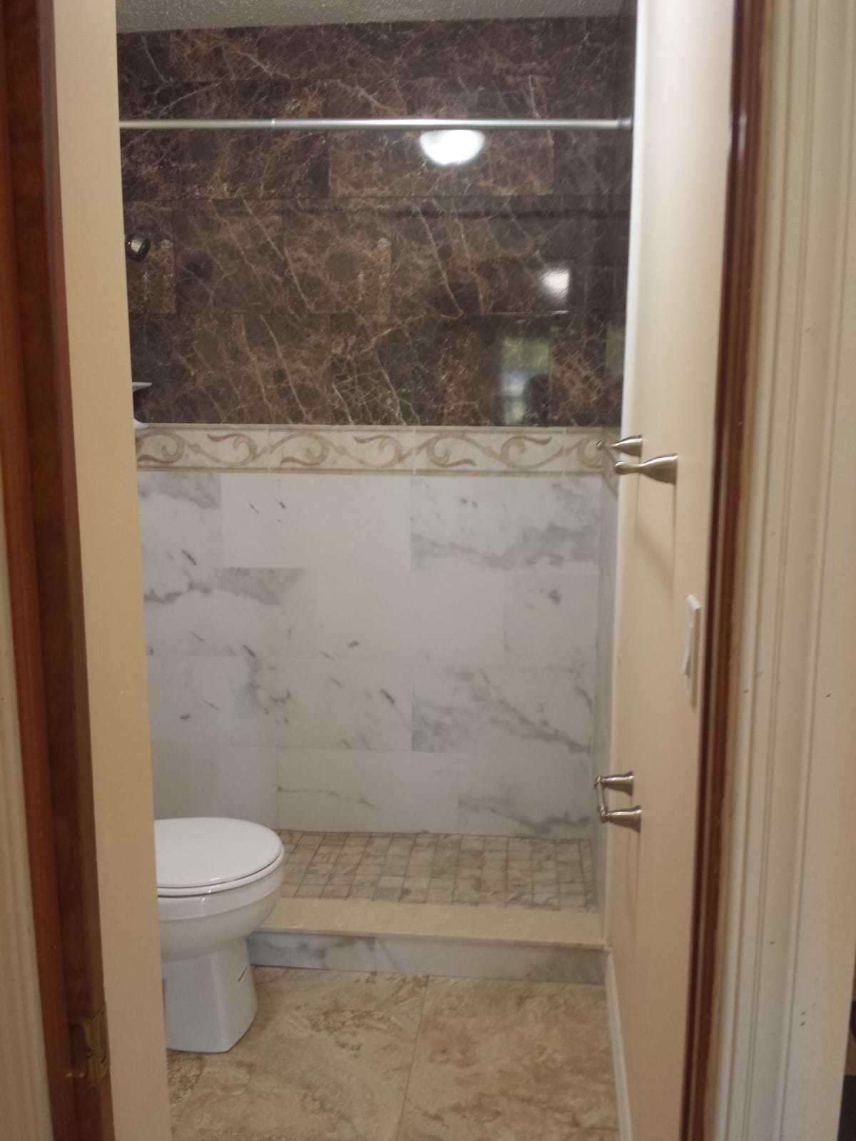 437 Kirk Road Palm Springs, FL 33461 - Photo 45 of 53 a bathroom with a toilet and a shower
