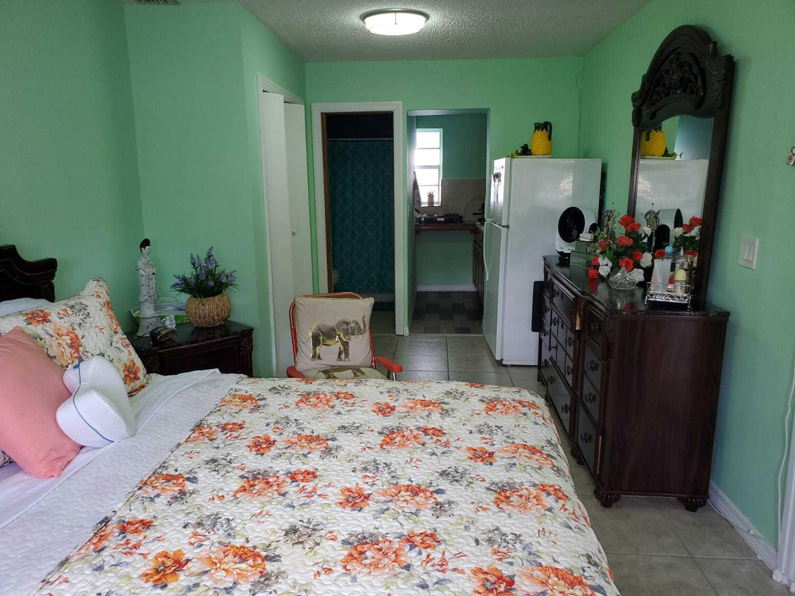 437 Kirk Road Palm Springs, FL 33461 - Photo 48 of 53 a bedroom with a bed and a closet