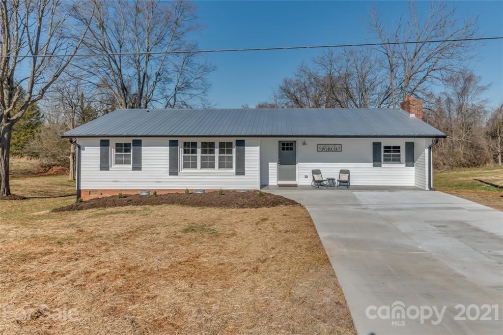 a front view of a house with yard