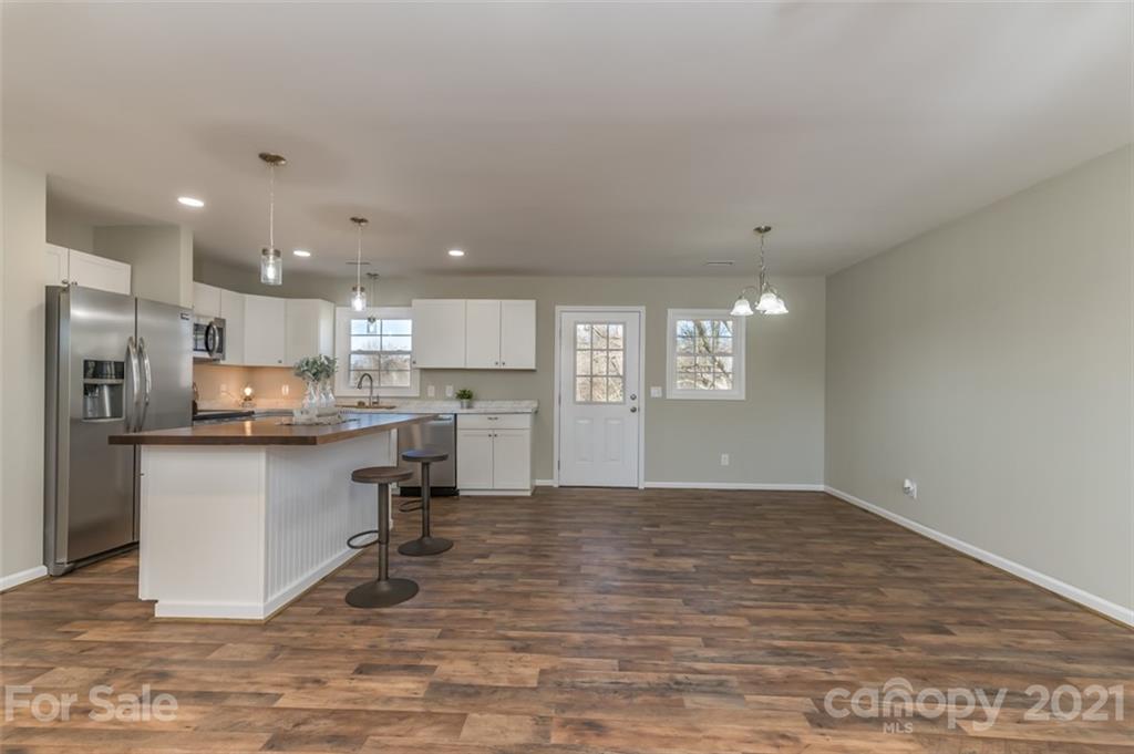 310 Webb Church Road Ellenboro, NC 28040 - Photo 18 of 35 a kitchen with a refrigerator and a sink