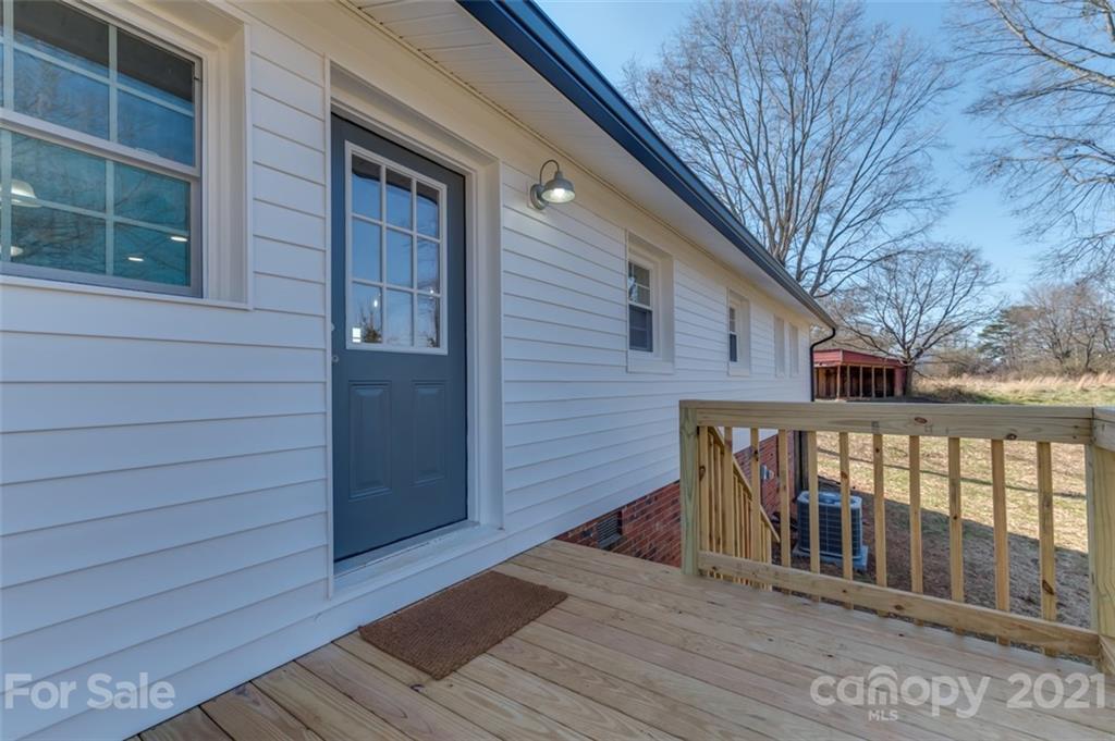 310 Webb Church Road Ellenboro, NC 28040 - Photo 2 of 35 a view of wooden house with a large window