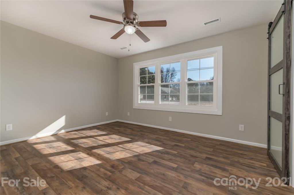 310 Webb Church Road Ellenboro, NC 28040 - Photo 29 of 35 a view of empty room with wooden floor and fan