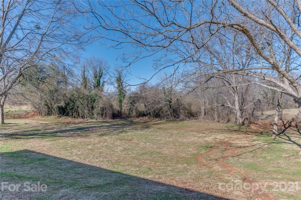 310 Webb Church Road Ellenboro, NC 28040 - Photo 4 of 35 a view of empty room with tree and wooden fence