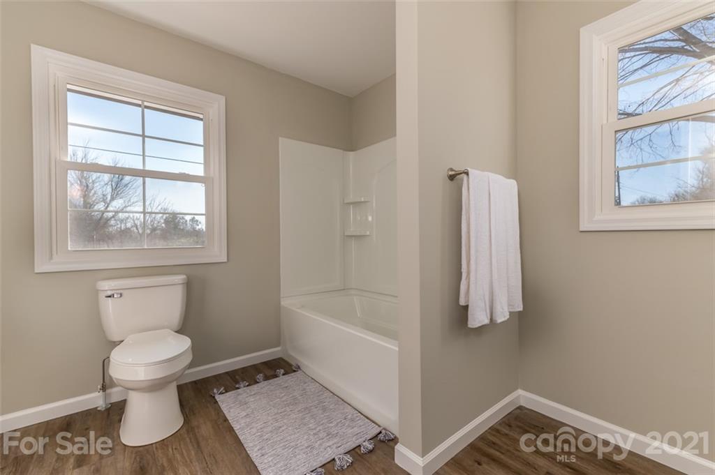310 Webb Church Road Ellenboro, NC 28040 - Photo 8 of 35 a bathroom with a toilet and a bathtub
