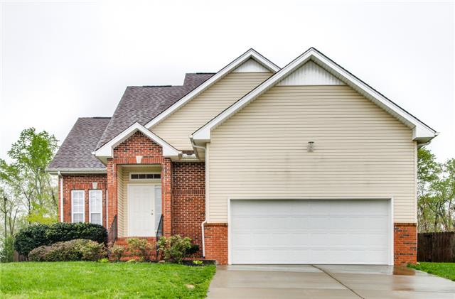 515 Berry Circle Springfield, TN 37172 - Photo 2 of 18 a front view of a house with a garden
