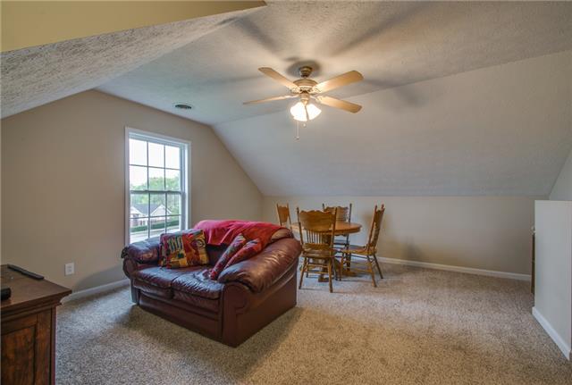 515 Berry Circle Springfield, TN 37172 - Photo 14 of 18 a living room with furniture a ceiling fan and a window