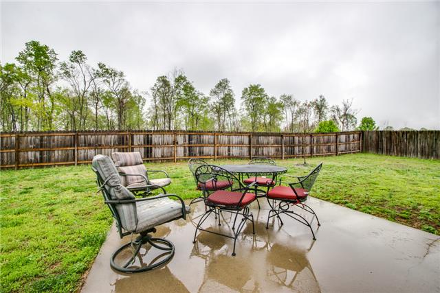 515 Berry Circle Springfield, TN 37172 - Photo 15 of 18 an outdoor sitting area with furniture and garden
