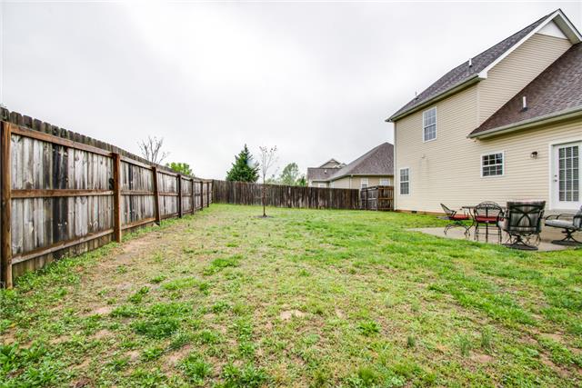 515 Berry Circle Springfield, TN 37172 - Photo 17 of 18 a backyard of a house with table and chairs