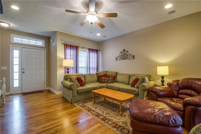 515 Berry Circle Springfield, TN 37172 - Photo 4 of 18 a living room with couches and a chandelier