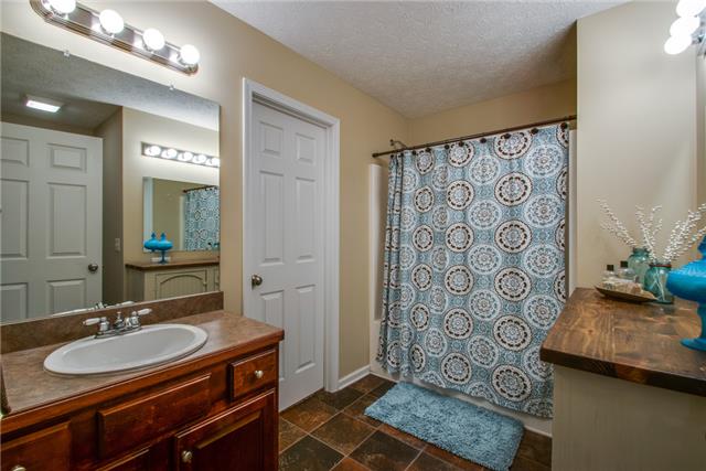 515 Berry Circle Springfield, TN 37172 - Photo 9 of 18 a bathroom with a sink and a mirror