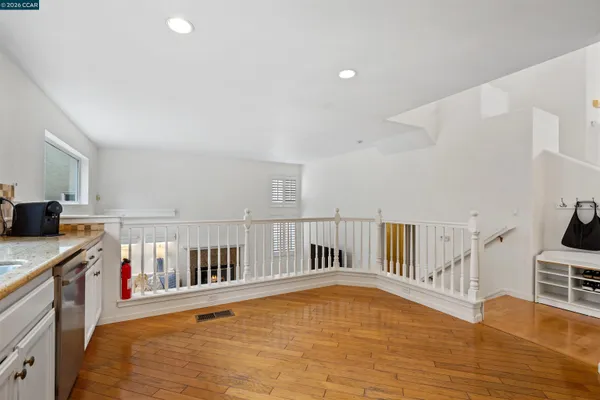 a view of kitchen with furniture and wooden floor