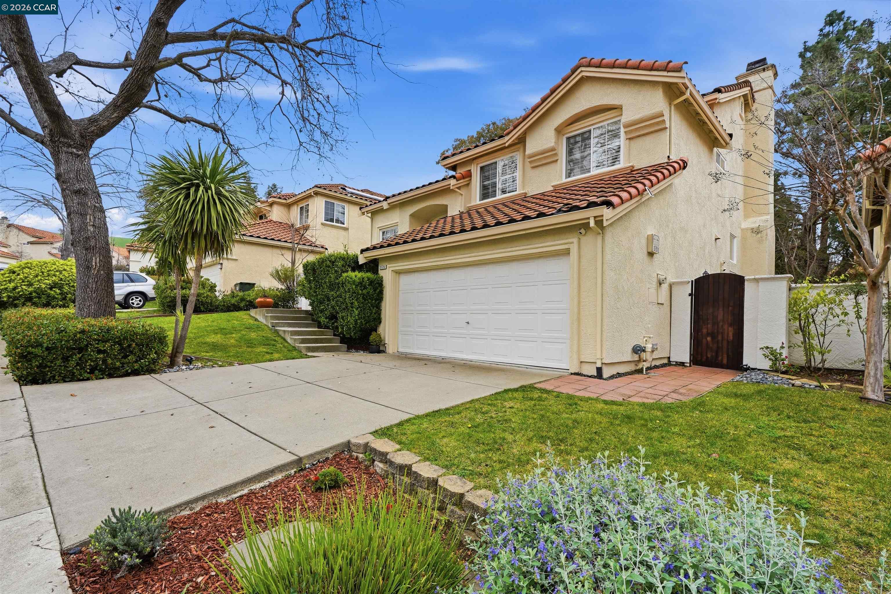 2175 Bluerock Circle Concord, CA 94521 - Photo 2 of 48 a front view of a house with a yard and garage