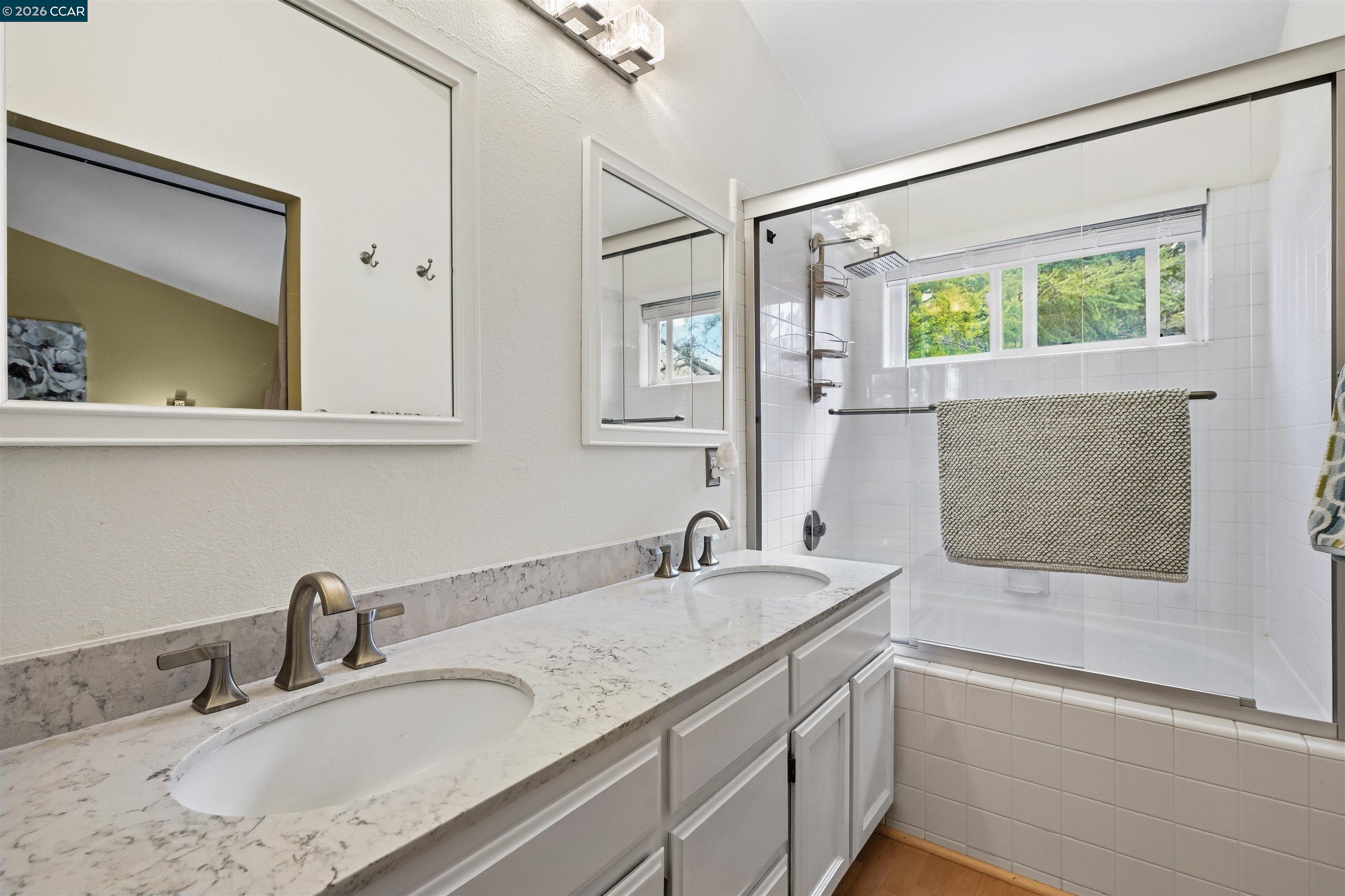 2175 Bluerock Circle Concord, CA 94521 - Photo 26 of 48 a bathroom with a granite countertop sink mirror and double