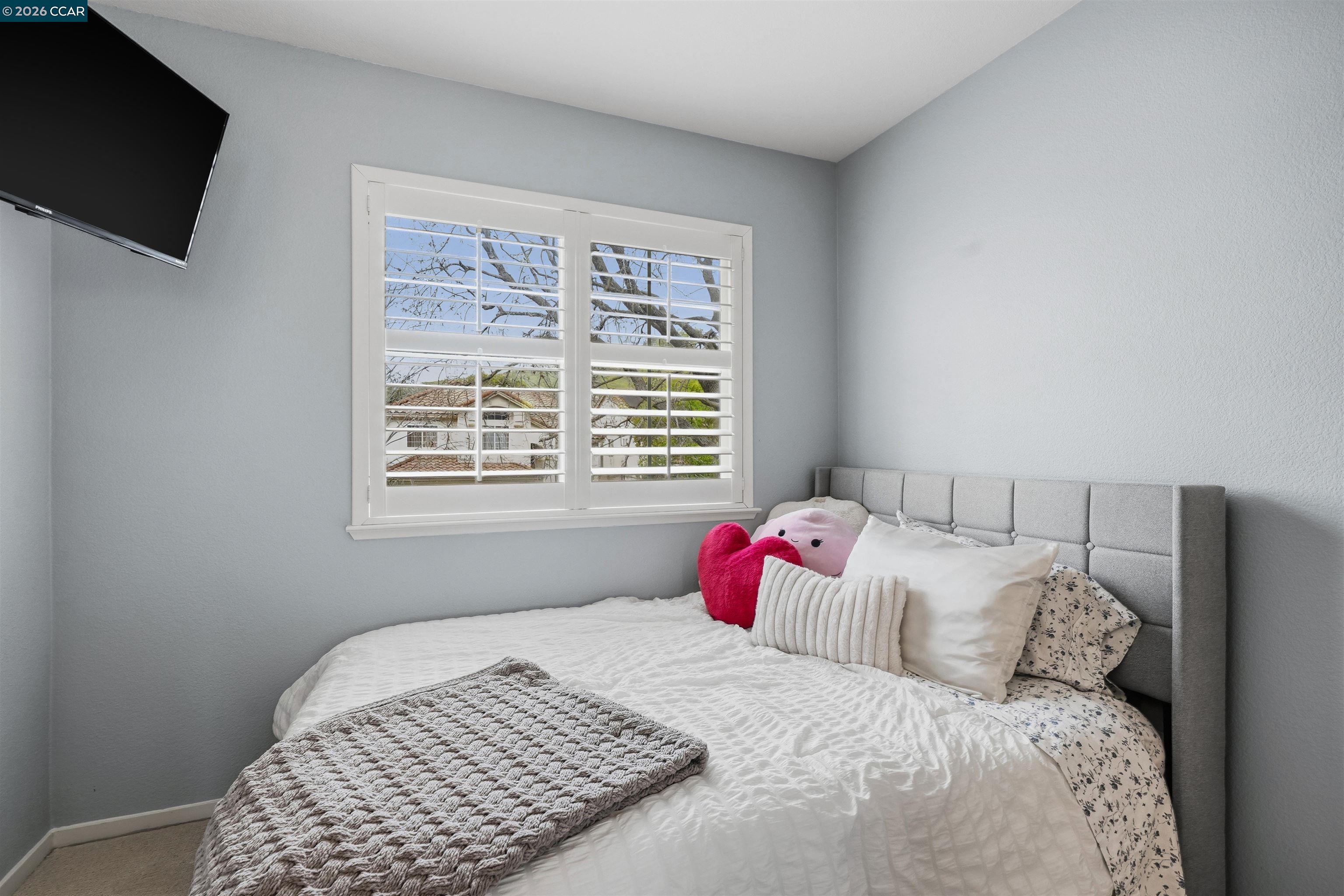 2175 Bluerock Circle Concord, CA 94521 - Photo 29 of 48 a bedroom with a bed and a window