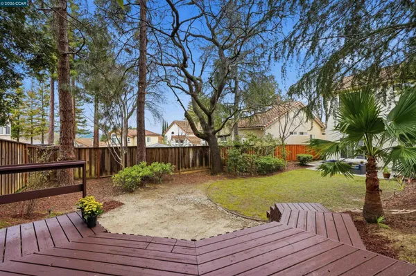 a view of a wooden deck with a yard