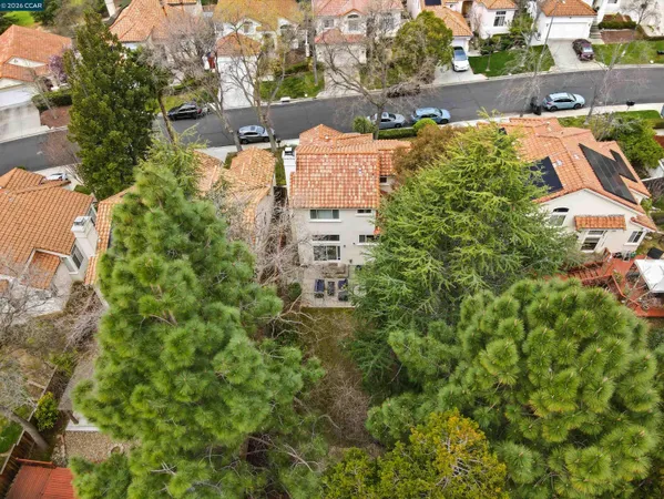 an aerial view of multiple houses with yard