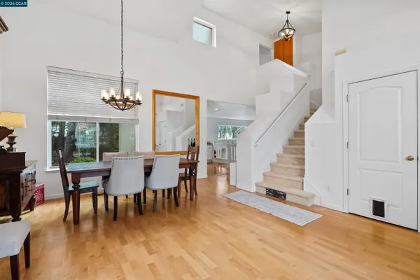 a view of a dining room with furniture window and wooden floor