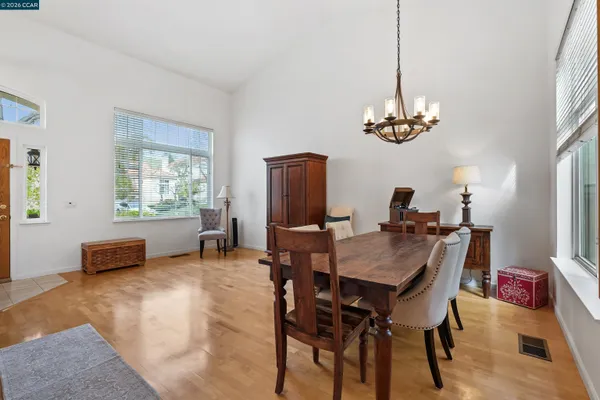 a view of a dining room with furniture window and wooden floor