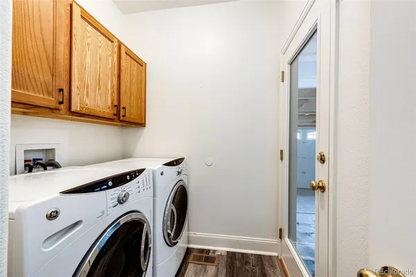 a view of storage and utility room with washer and dryer