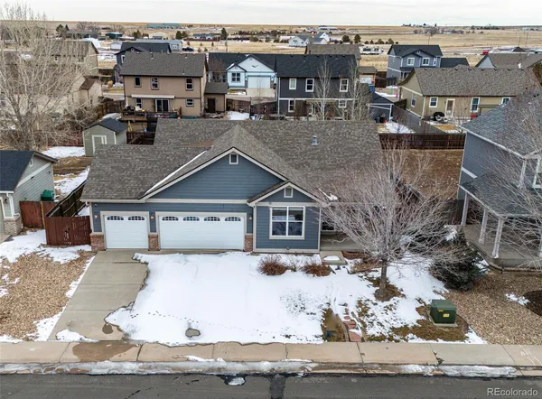an aerial view of a house with yard