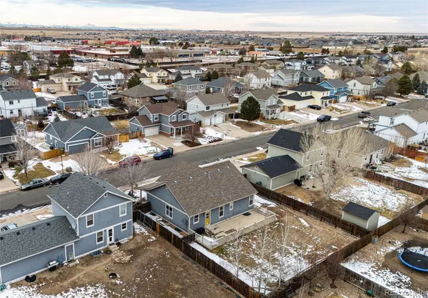 an aerial view of residential houses with outdoor space