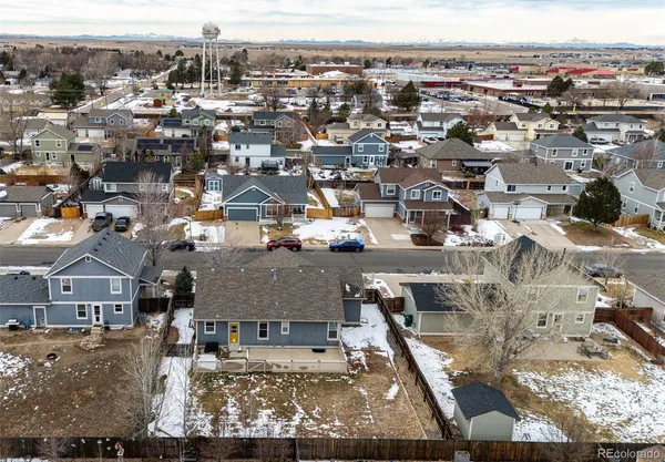 an aerial view of a house with a mountain view