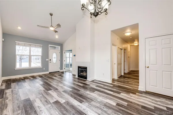 wooden floor in an empty room with a fireplace
