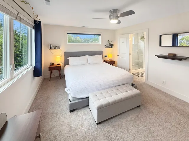 a bed room with a bed and a window