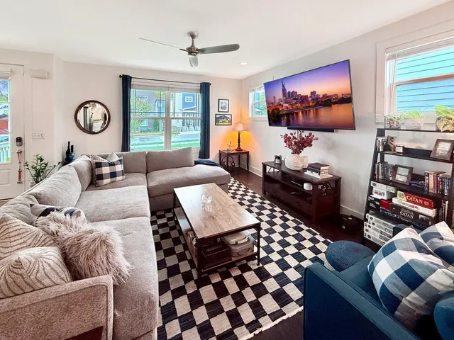 a living room with furniture and a flat screen tv