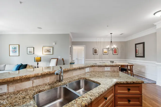 a kitchen with granite countertop a sink and a counter top space