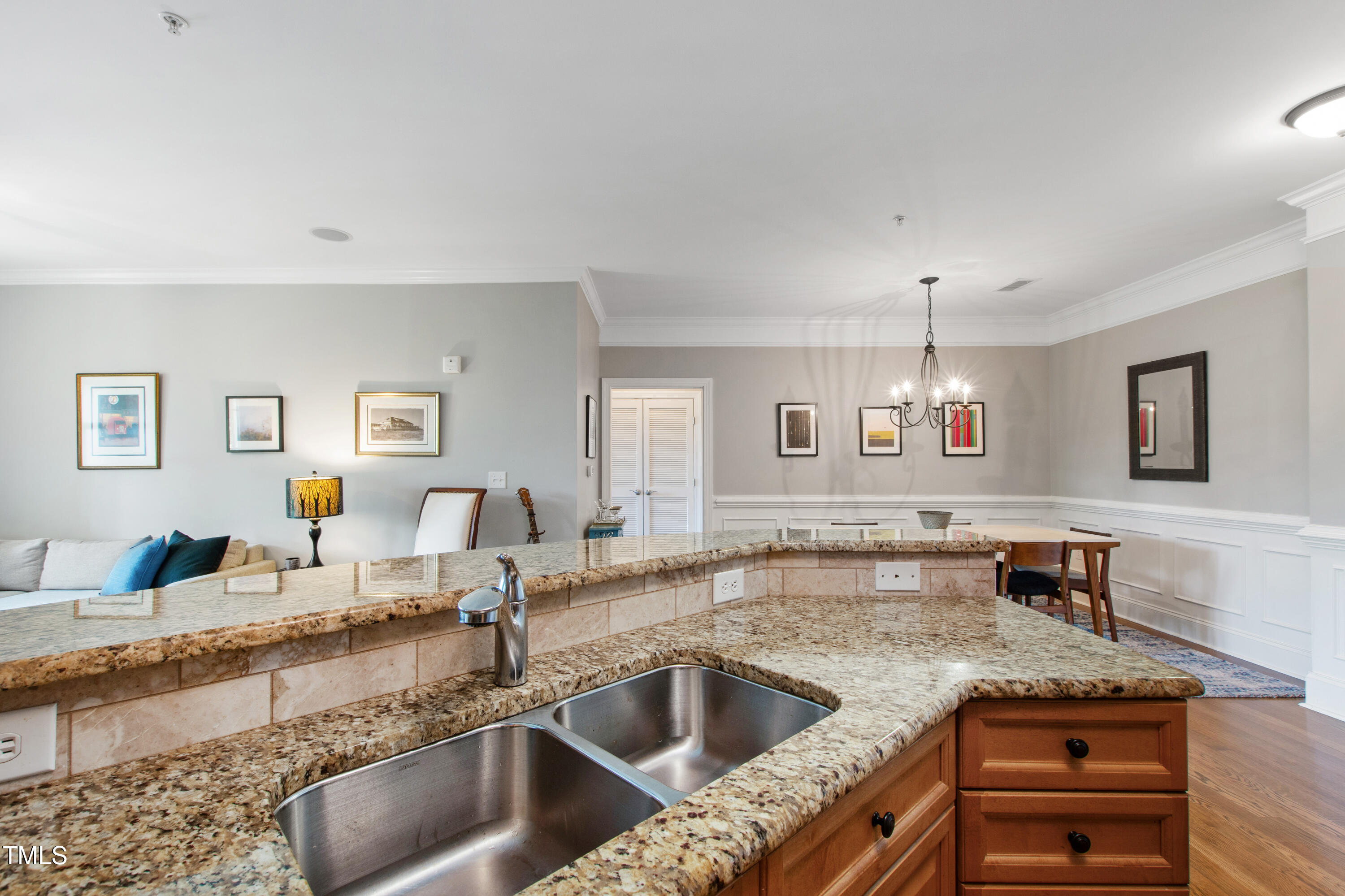 340 Allister Drive, Unit 201 Raleigh, NC 27609 - Photo 11 of 37 a kitchen with granite countertop a sink and a counter top space