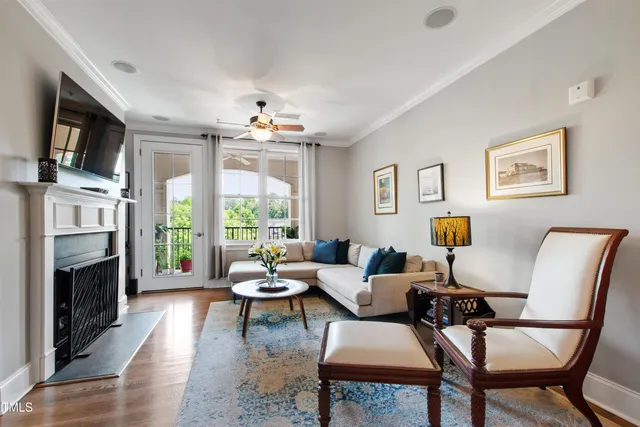 a living room with furniture fireplace and a flat screen tv