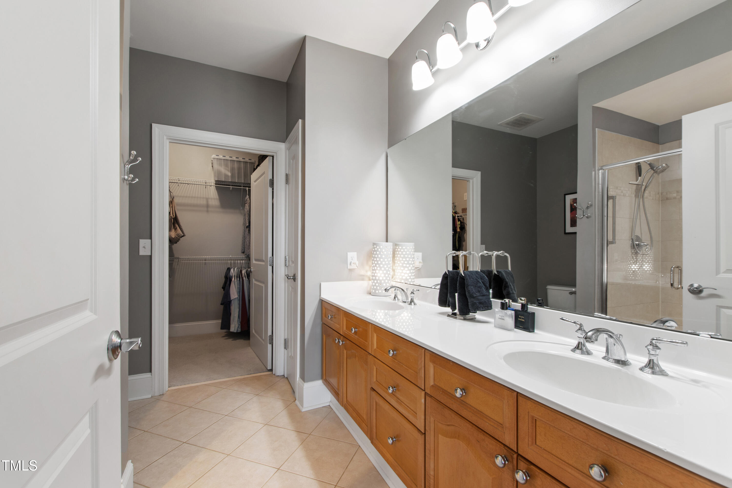 340 Allister Drive, Unit 201 Raleigh, NC 27609 - Photo 21 of 37 a spacious bathroom with a double vanity sink mirror and double