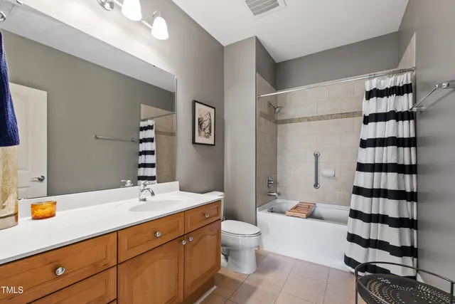 a bathroom with a sink a double vanity and a mirror