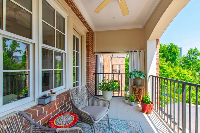 a view of kitchen with furniture and windows