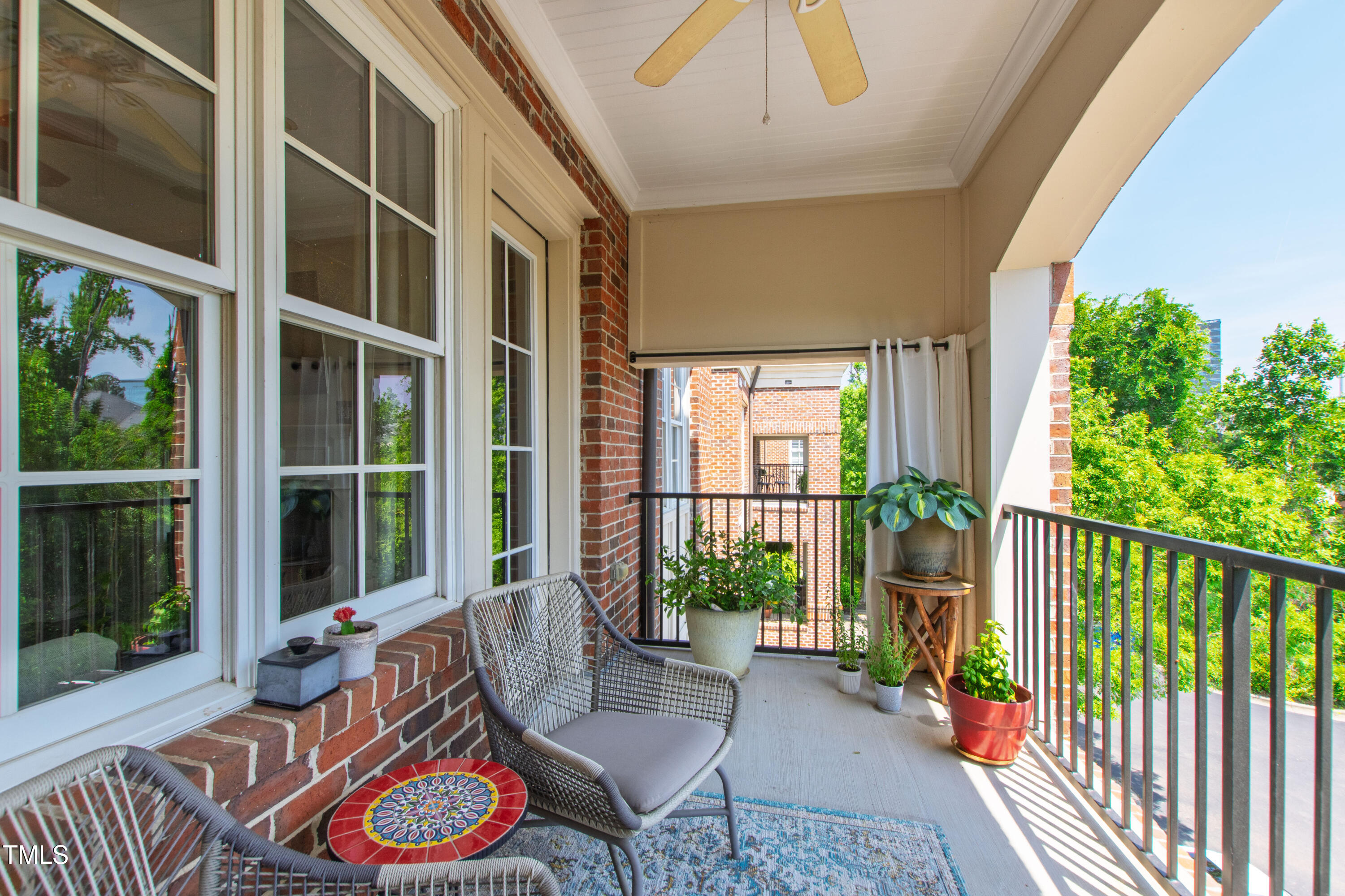 340 Allister Drive, Unit 201 Raleigh, NC 27609 - Photo 30 of 37 a balcony with furniture and garden view