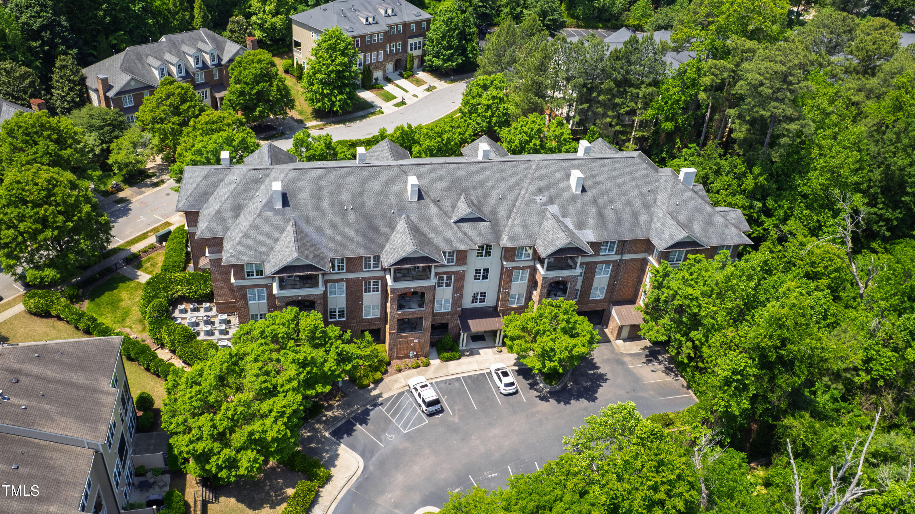 340 Allister Drive, Unit 201 Raleigh, NC 27609 - Photo 37 of 37 an aerial view of a house with a yard and garden