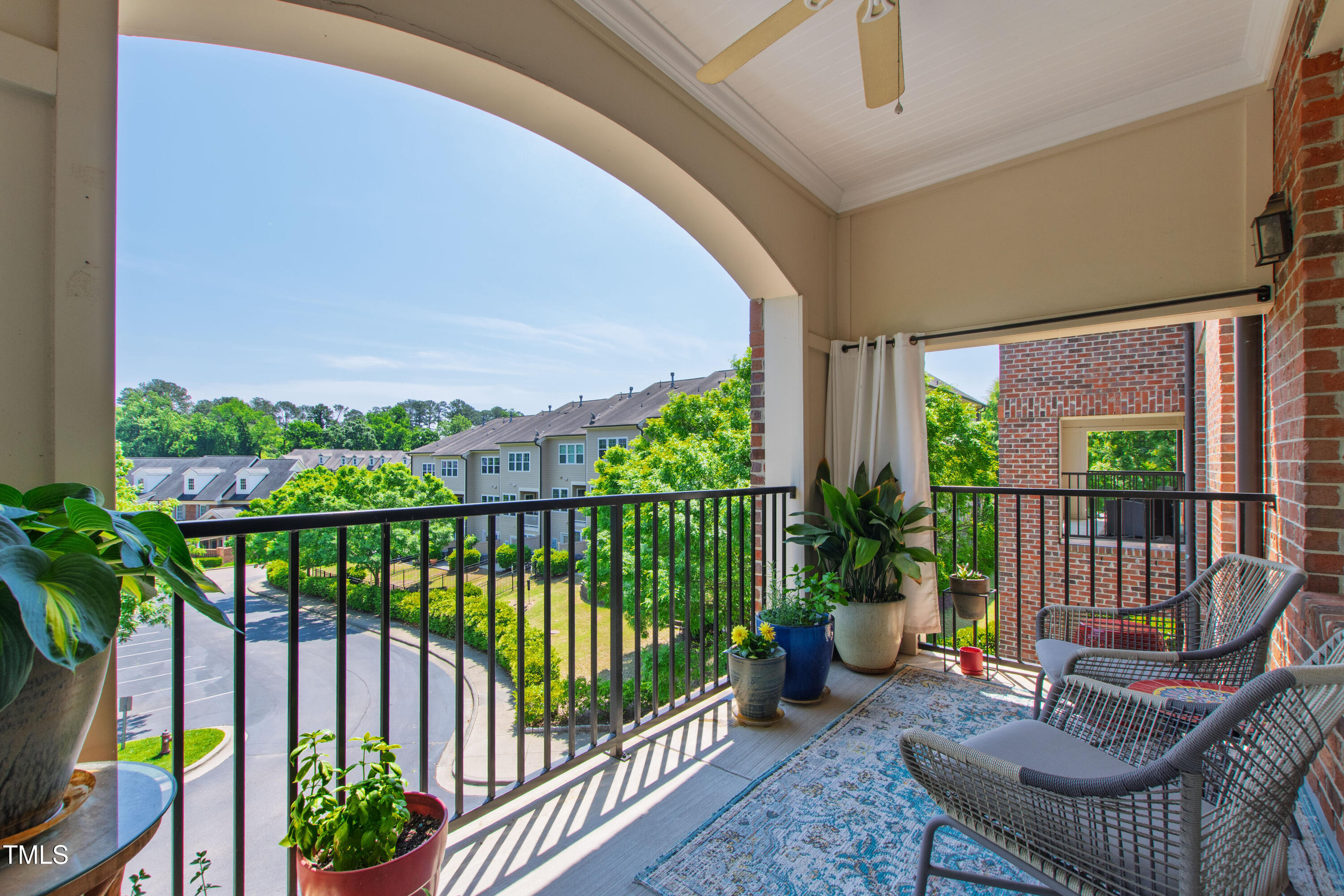 340 Allister Drive, Unit 201 Raleigh, NC 27609 - Photo 4 of 37 a view of a chair and table in the balcony
