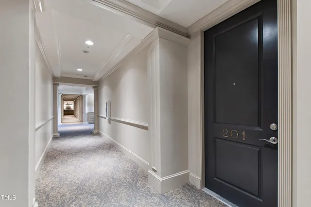 a view of a hallway with an entryway