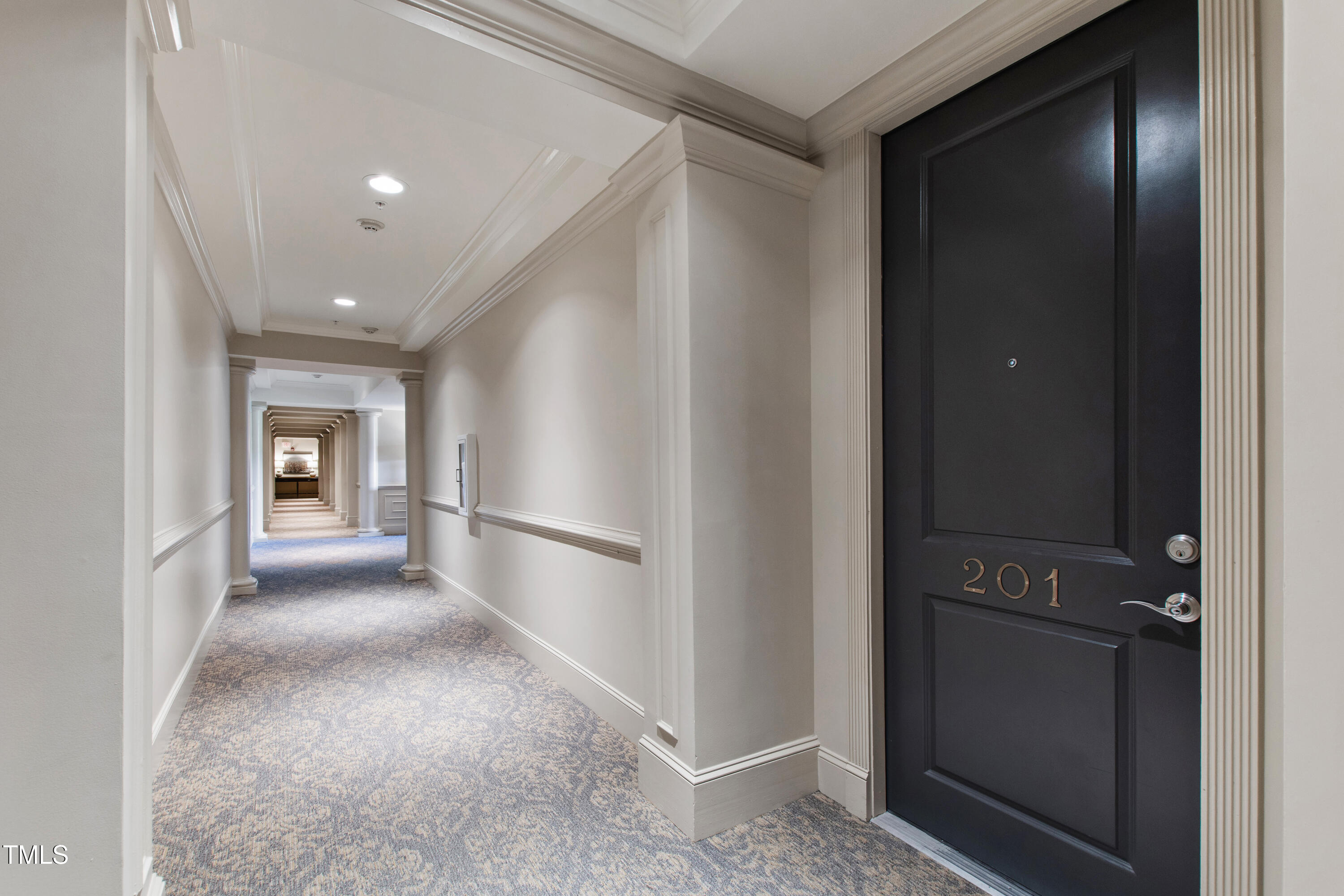 340 Allister Drive, Unit 201 Raleigh, NC 27609 - Photo 7 of 37 a view of a hallway with an entryway