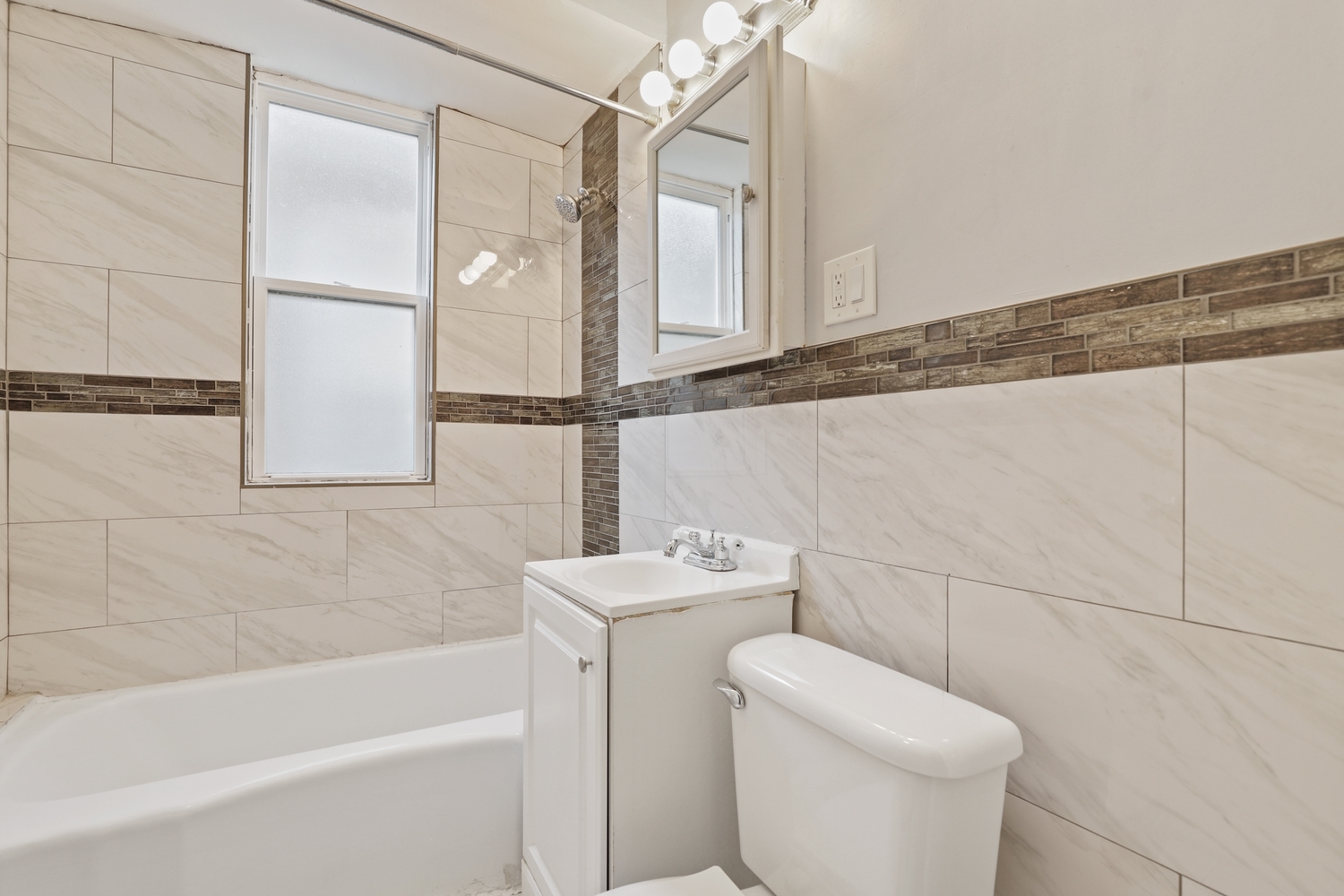 8810 South Racine Avenue Chicago, IL 60620 - Photo 14 of 23 a bathroom with a sink a toilet and bathtub