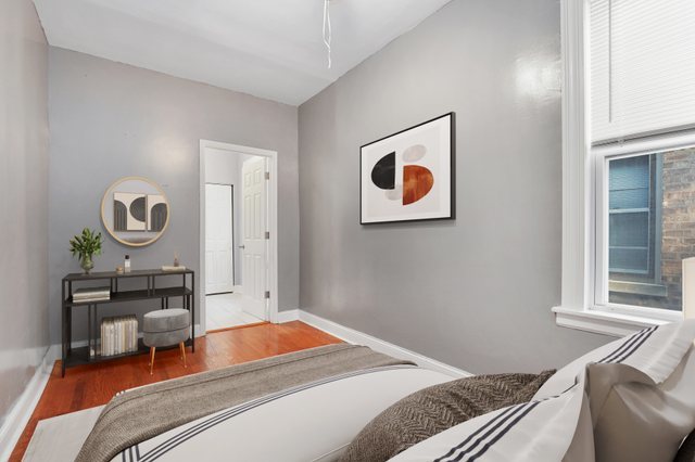 8810 South Racine Avenue Chicago, IL 60620 - Photo 9 of 23 a bedroom with a bed and a window