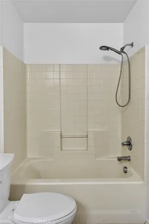 a bathroom with a shower and a toilet