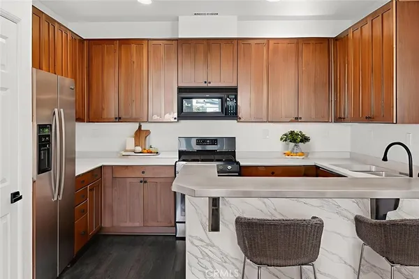 a kitchen with a sink cabinets and outdoor space