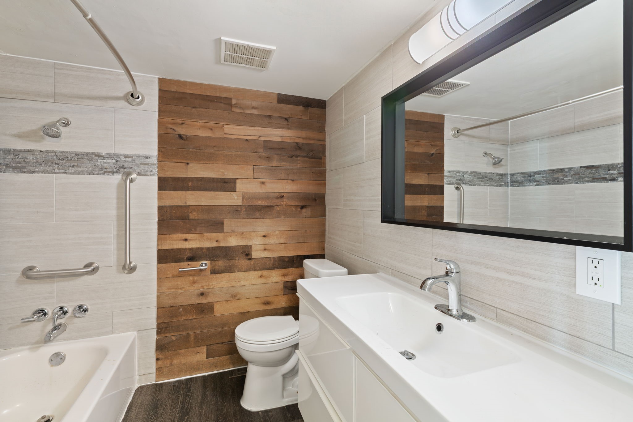 5005 Manor Road, Unit 132 Austin, TX 78723 - Photo 9 of 28 a bathroom with a sink a toilet and shower