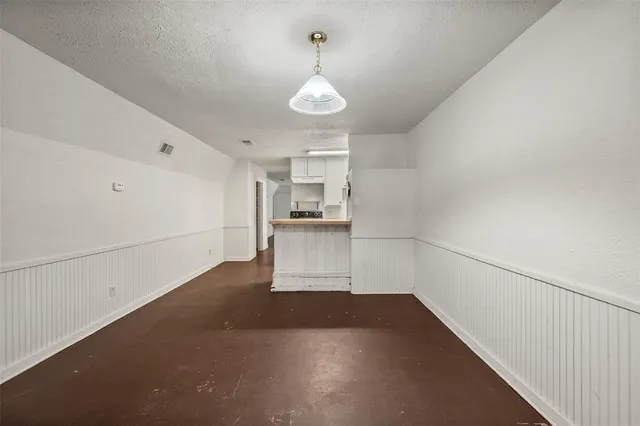 a view of a kitchen with a sink and dishwasher