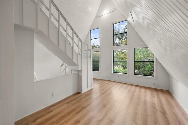a view of an entryway with wooden floor