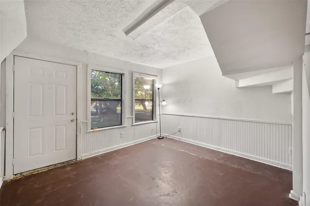 an empty room with windows