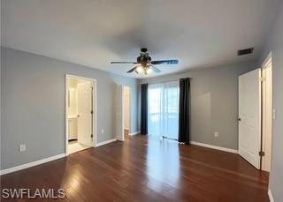 152 Lake Point Lane, Unit 4A Naples, FL 34112 - Photo 11 of 15 a view of a hallway with wooden floor and a chandelier