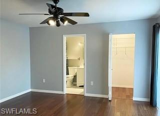 152 Lake Point Lane, Unit 4A Naples, FL 34112 - Photo 13 of 15 a view of an empty room with wooden floor